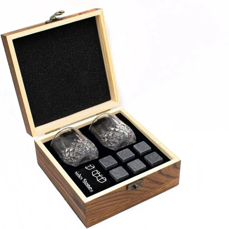 Open wooden whiskey gift box with two crystal-cut glasses and six granite chilling stones