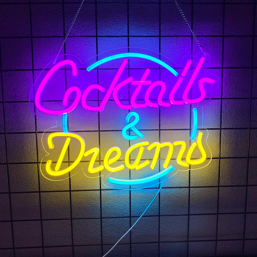 Cocktails and Dreams script LED neon sign in pink, gold and blue