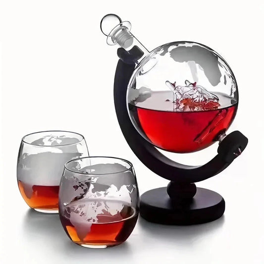 Crystal globe whiskey decanter with etched world map design and two matching rocks glasses